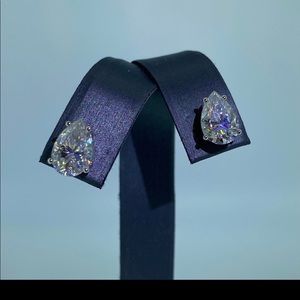 Pear moissanite and 14k white gold studs.